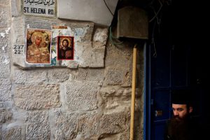 An Orthodox Christian priest walks in the Christian Quarter of Jerusalem's Old City June 21, 2016. REUTERS/Ronen Zvulun